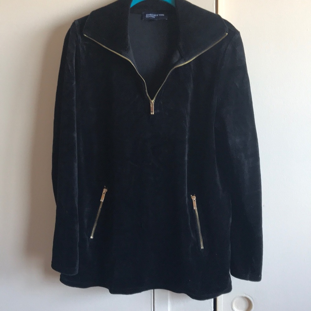 A black sweater with a zipper going halfway